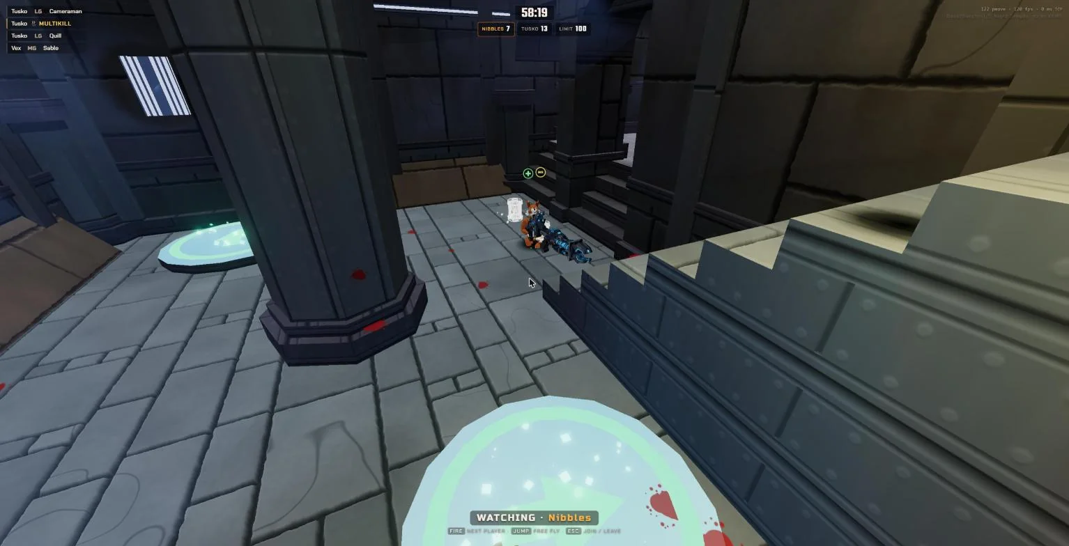 The arena from a spectator's view, with the scoreboard and kill feed